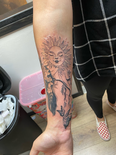 Explore women's arm sleeve tattoo ideas, creative tattoo ideas in Jefferson, available at Slammin Ink Tattoo