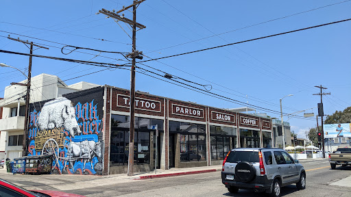 Explore half a sleeve tattoo ideas, creative tattoo ideas in Venice, available at KISS KISS TATTOO & PIERCING