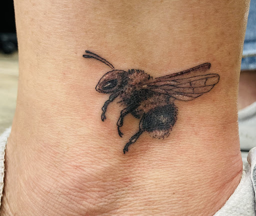 Explore tribal tattoo cover up ideas, creative tattoo ideas in Buford, available at Wild Tribe Tattoos and Piercings