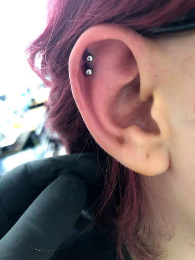 Explore cover up tattoo ideas for names on wrist, creative tattoo ideas in Palm Harbor, available at Angry Owl Tattoo and Piercing