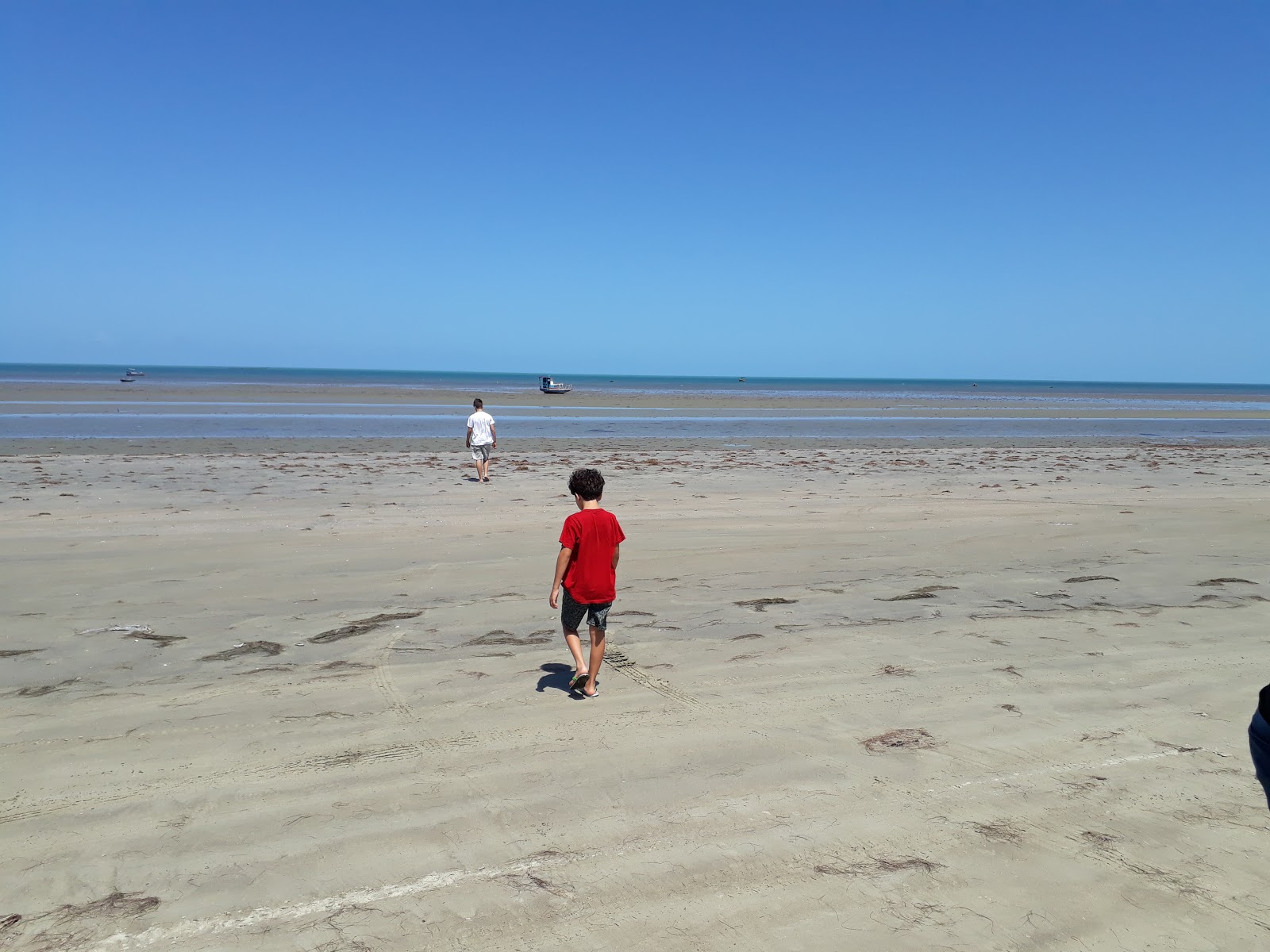 Photo de Plage de Placa avec l'eau cristalline de surface