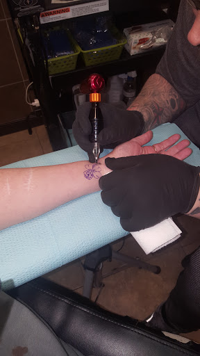 Explore upper back tattoo ideas for guys, creative tattoo ideas in Raleigh, available at Rock N Roll Tattoo & Piercing