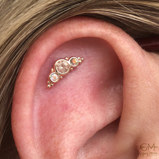 Explore ripped tattoo ideas, creative tattoo ideas in Medford, available at Agave in Bloom Piercing & Fine Jewelry