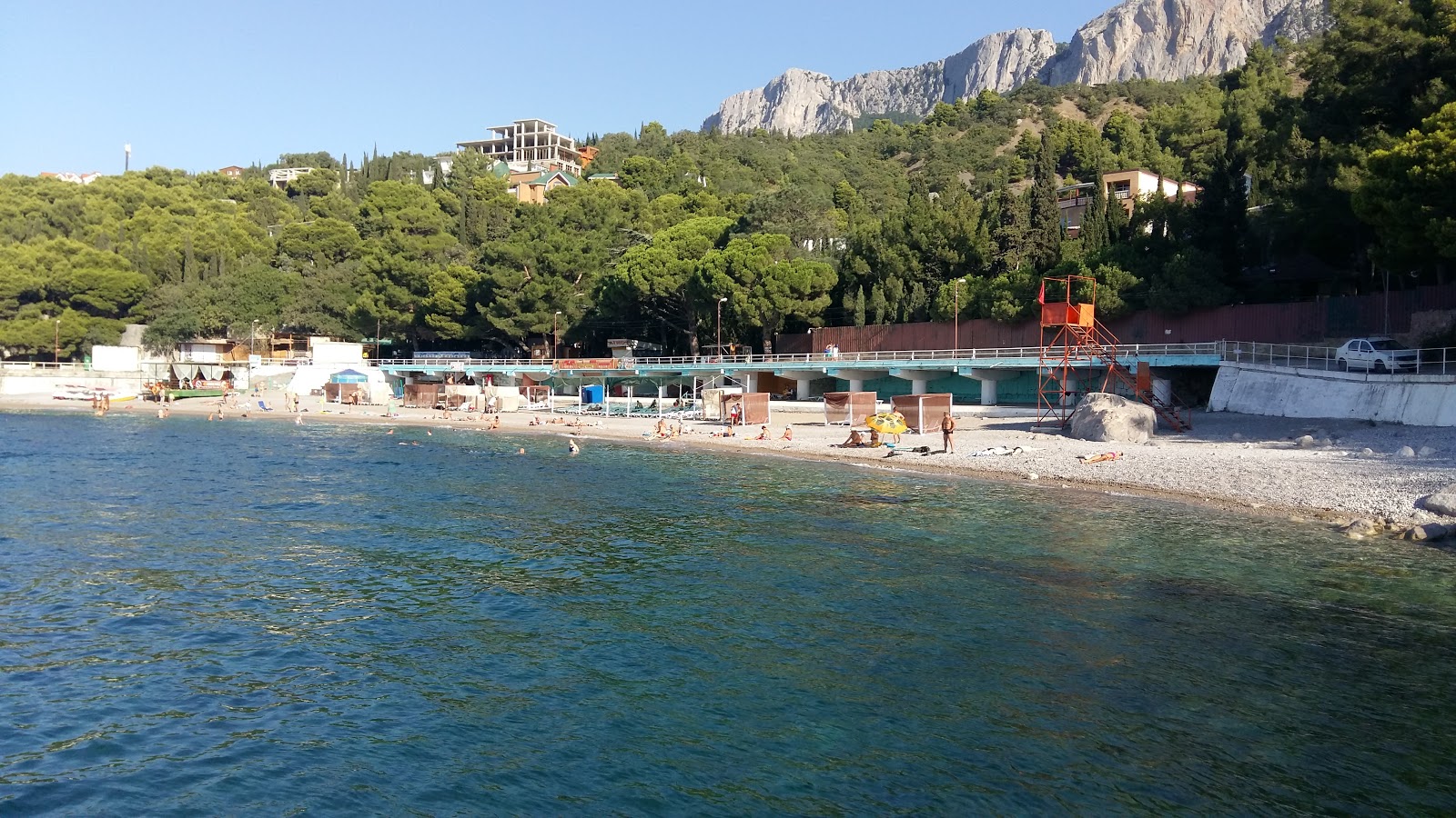 Photo of Castropol hotel beach with turquoise pure water surface