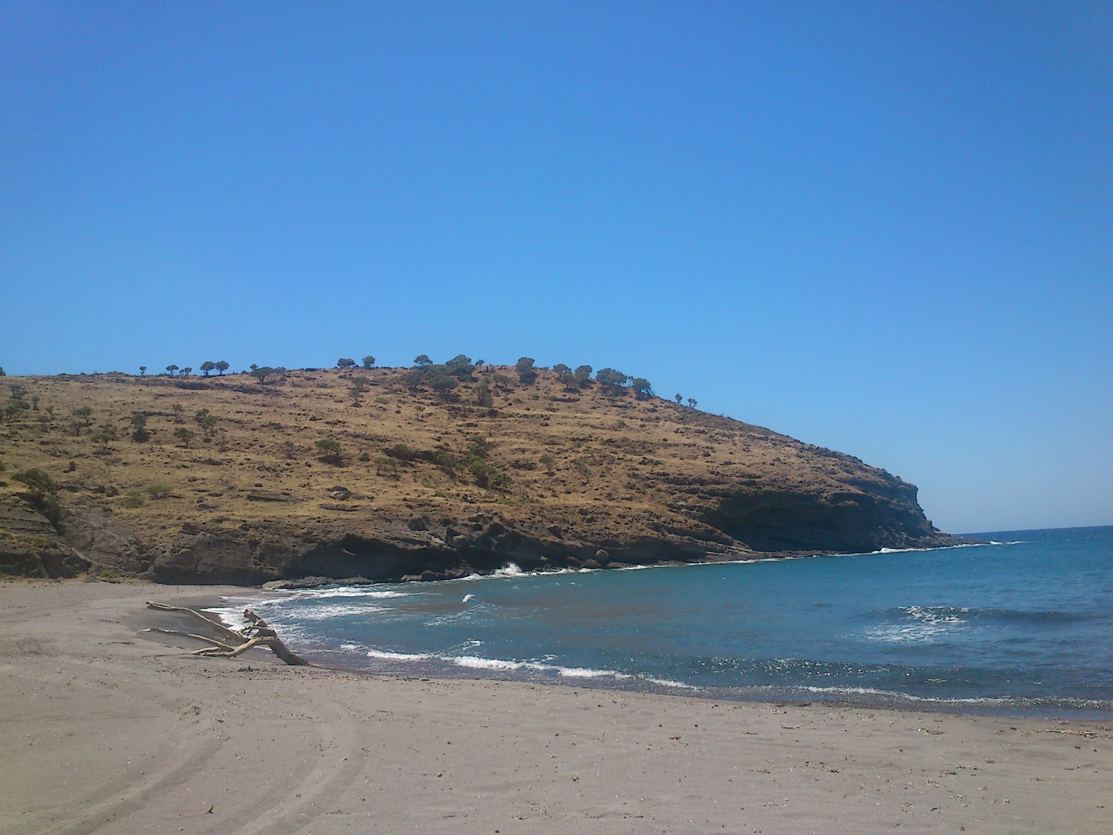 Foto av Agios Dimitrios beach med grå sand yta