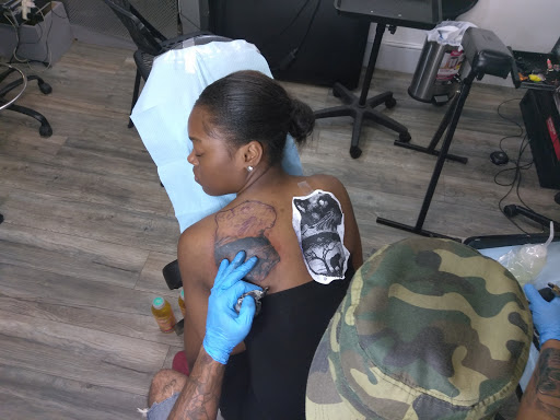 Explore belly button tattoos ideas, creative tattoo ideas in Atlanta, available at Iron Palm Tattoos & Body Piercing Atlanta