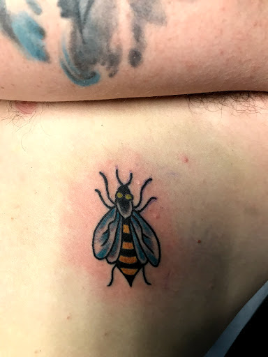 Explore red bird tattoo ideas, creative tattoo ideas in Las Vegas, available at Last Chance Tattoo