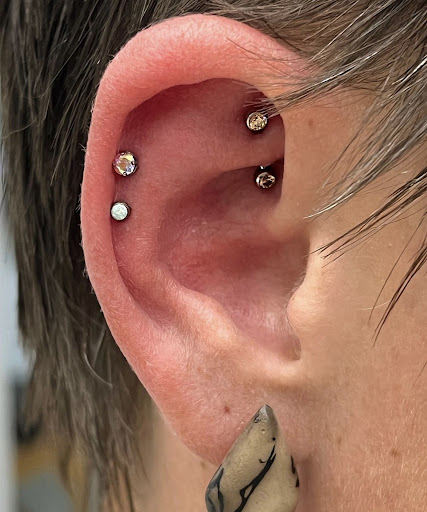 Explore women's lower back tattoo ideas, creative tattoo ideas in San Antonio, available at Platinum Body Piercings