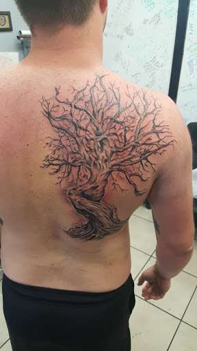 Explore e.t. tattoo ideas, creative tattoo ideas in Ocala, available at Lone Wolf Tattoo