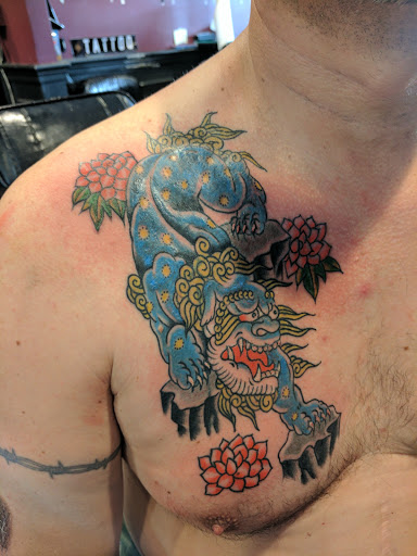 Explore middle neck tattoo ideas, creative tattoo ideas in Bayside, available at Top Shelf Tattooing