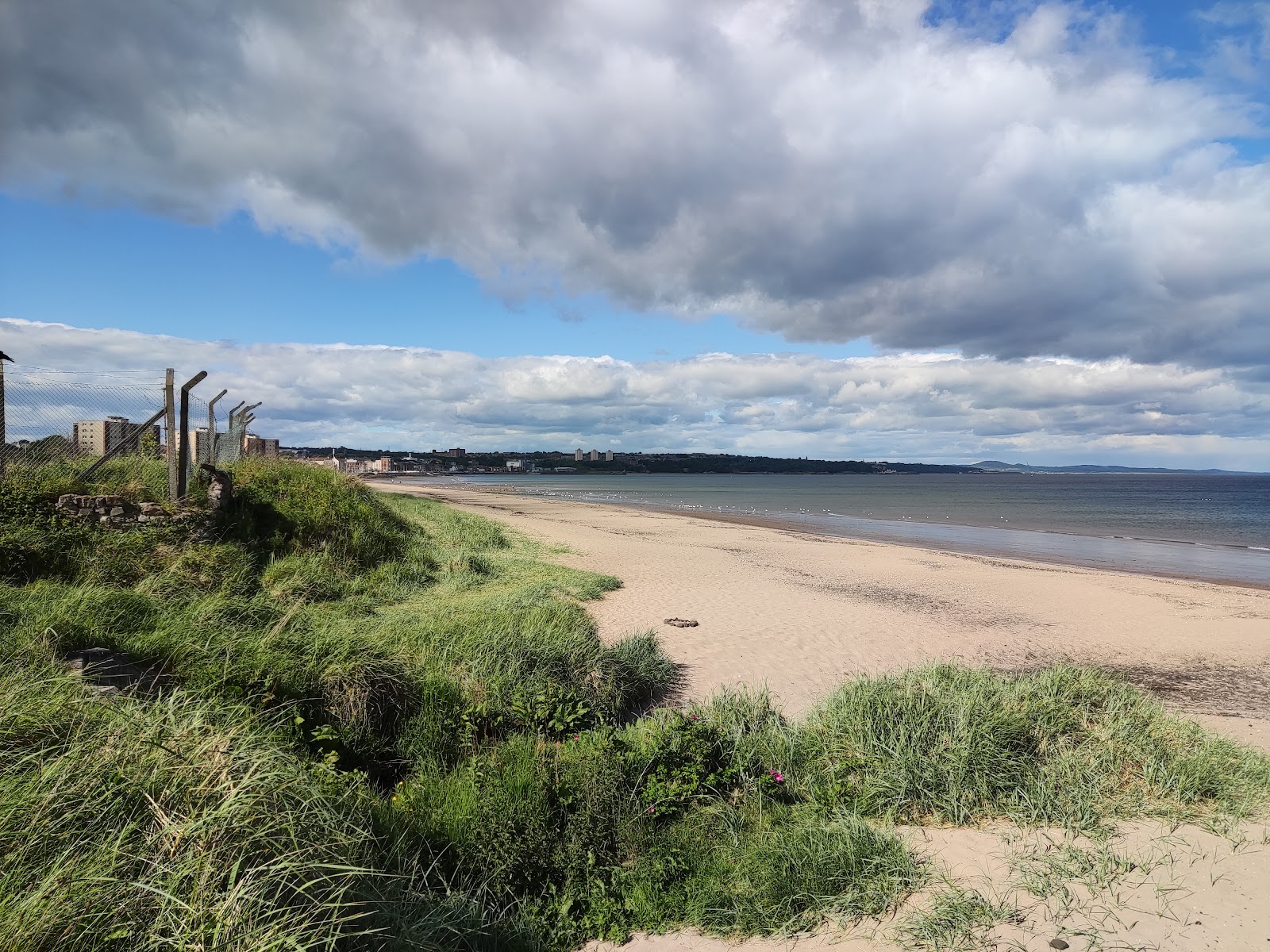 Photo of Seafield Beach with turquoise pure water surface