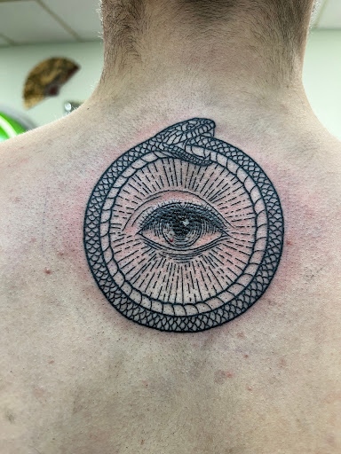 Explore elegant spine tattoo ideas, creative tattoo ideas in Mckinney, available at Borrowed Time Fine Art Gallery Tattoo Shop