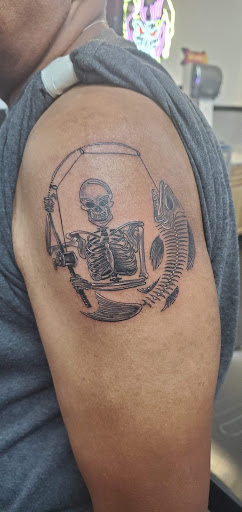 Explore men's back shoulder tattoo ideas, creative tattoo ideas in Hilliard, available at 22 Caliber Tattoo Mega Studio