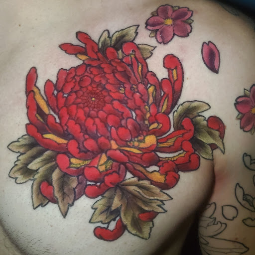Explore simple flower tattoo ideas, creative tattoo ideas in Buford, available at Inked Arts Tattoo Studio