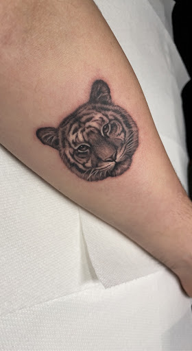 Explore bodybuilding tattoo ideas, creative tattoo ideas in Lake Villa, available at Eternal Tiger Tattoo