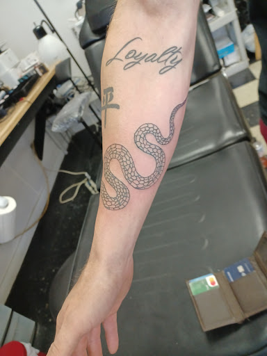 Explore cash tattoo ideas, creative tattoo ideas in Owosso, available at Twisted ink tattoo