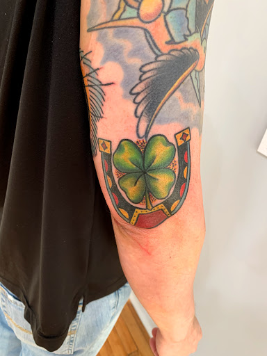 Explore fishing tattoo ideas for females, creative tattoo ideas in Kansas City, available at Golden Stag Tattoo and Gallery