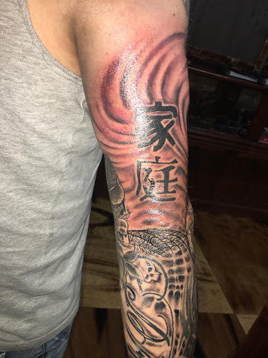 Explore design tattoo ideas for men, creative tattoo ideas in Peoria, available at Hot Spot Tattoo and Piercing