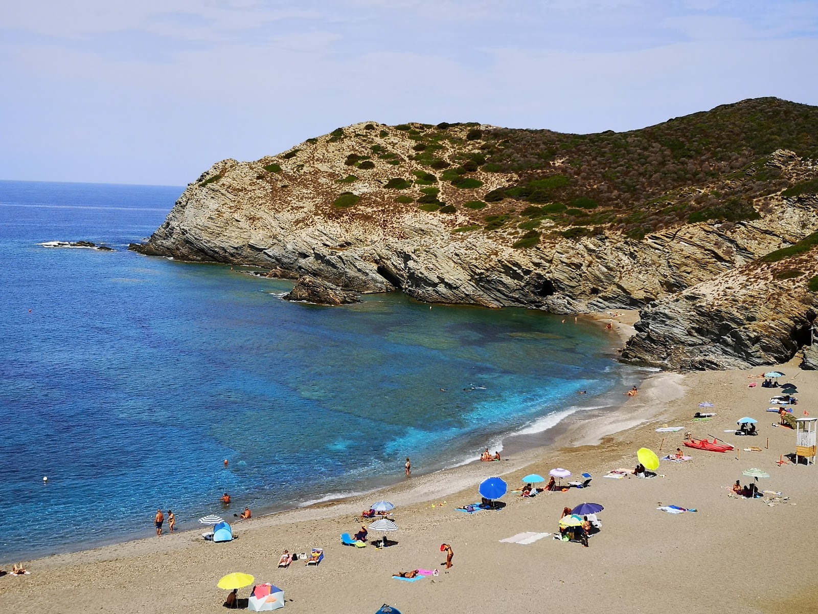 Foto van Cala dell'Argentiera met turquoise puur water oppervlakte