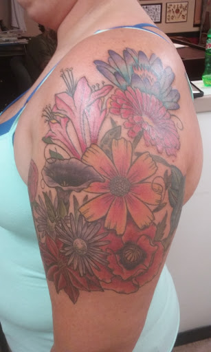 Explore tattoo ideas dolphin, creative tattoo ideas in Asheville, available at Victory Blvd Tattoo