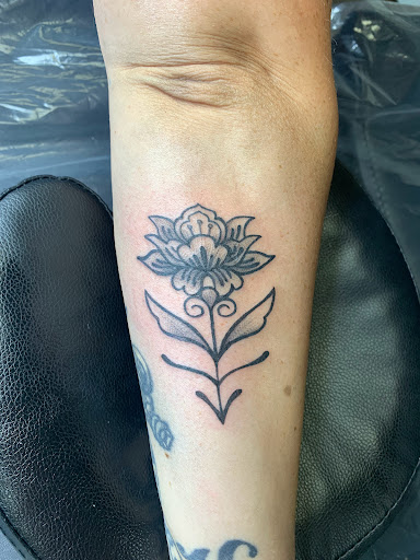Explore letter t tattoo ideas, creative tattoo ideas in Lake City, available at Crooked Spines Tattoo Studio