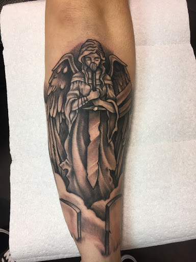 Explore rip neck tattoo ideas, creative tattoo ideas in Madison, available at ART IMMORTAL TATTOO