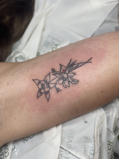 Explore orchid tattoo ideas, creative tattoo ideas in Avon, available at Avanti Tattoo
