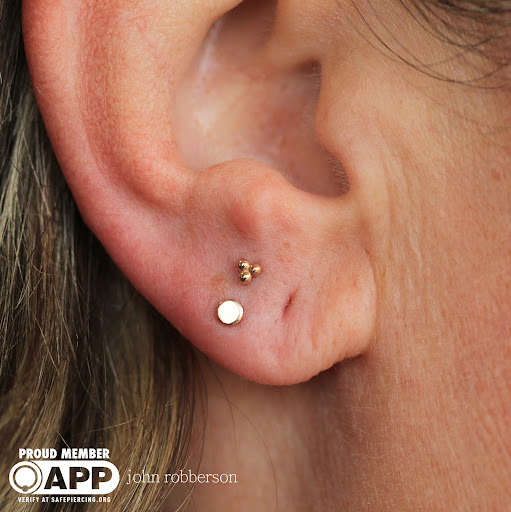 Explore womb tattoo ideas, creative tattoo ideas in Fort Myers, available at Tiger Lotus Tattoo and Piercing