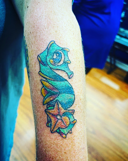 Explore arm tattoo ideas for females, creative tattoo ideas in Cocoa, available at Rorschach Tattoo Shop and Piercing Studio