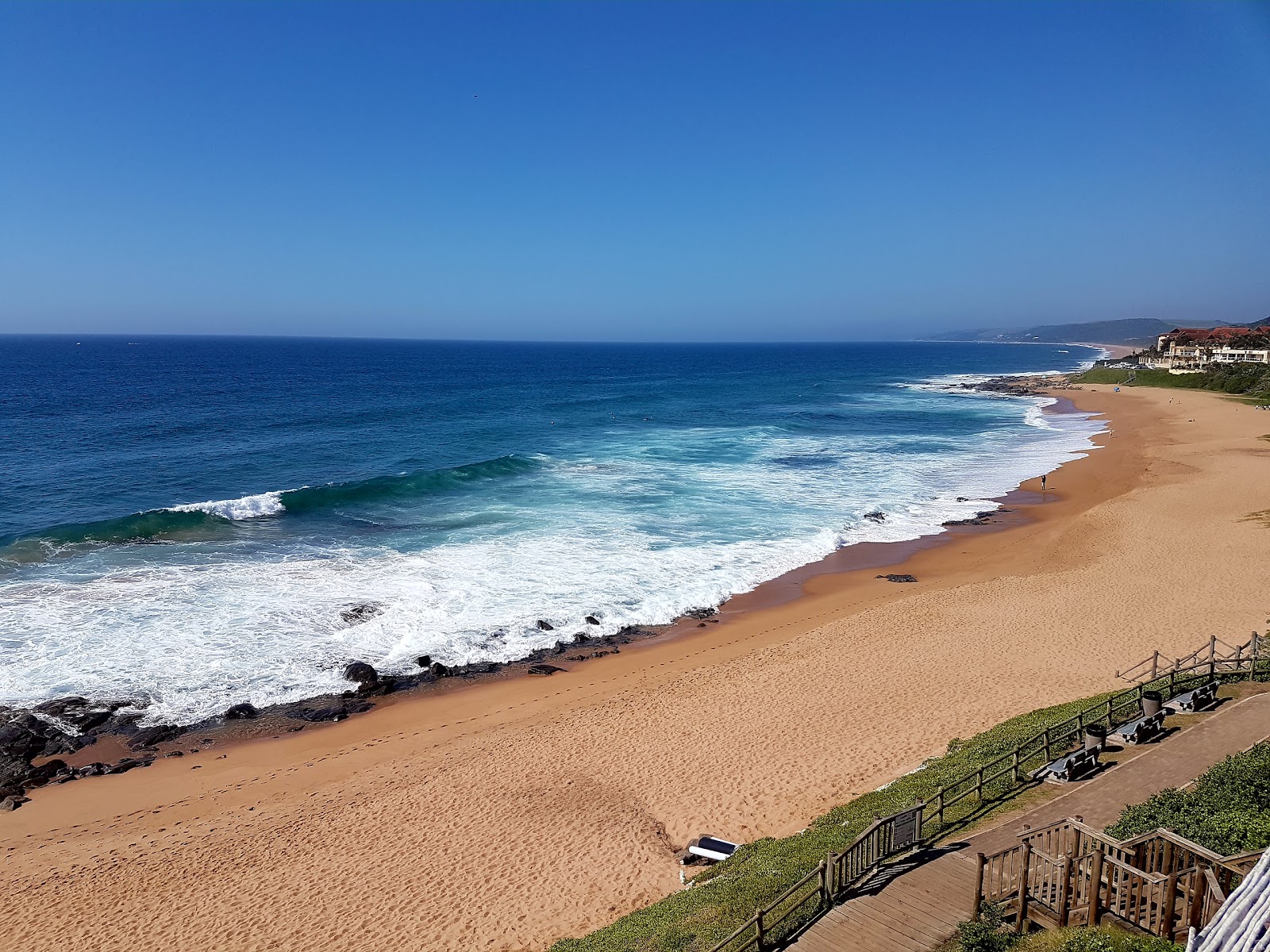 Photo of Zimbali beach with brown fine sand surface