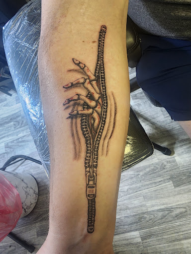 Explore leg tattoo ideas for men, creative tattoo ideas in Sioux City, available at Tattoo Monkey