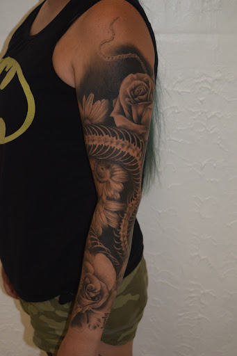 Explore boxing gloves tattoo ideas, creative tattoo ideas in Sparta, available at Black Sheep Studios