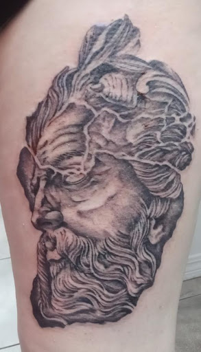 Explore upper back tattoo ideas for guys, creative tattoo ideas in Orange Park, available at Big City Tattoo and Piercing