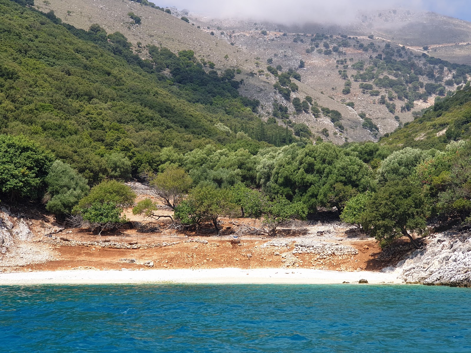 Photo of Kapsolimionas beach with turquoise pure water surface