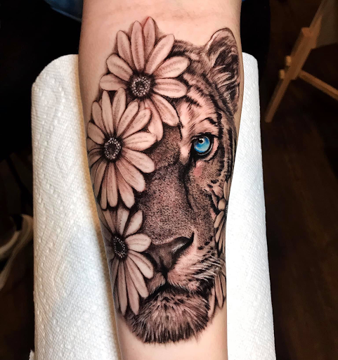 Find poppy tattoo ideas for your next unique tattoo in Johnson City at Gold Cross Tattoo Co.