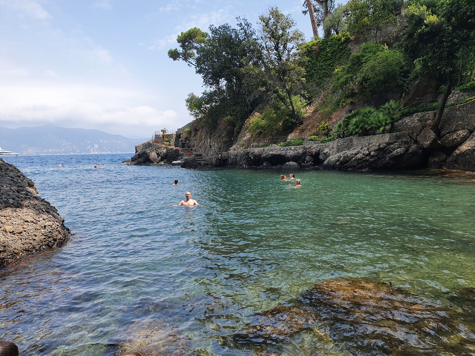 Spiaggia dell'Olivetta'in fotoğrafı mavi saf su yüzey ile