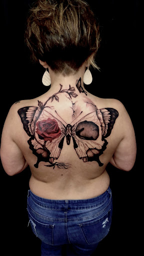 Find tattoo ideas between breast for your next unique tattoo in Mc Gregor at INKspiration Tattoo Studio