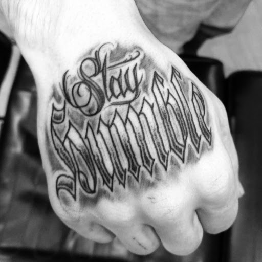 Explore sun tattoo ideas for men, creative tattoo ideas in Ridge, available at Masquerade Tattoo Shop