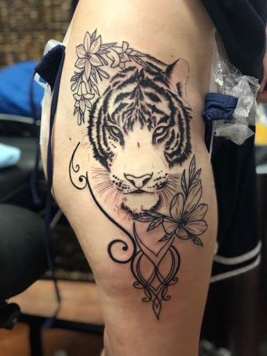 Explore dirtbike tattoo idea, creative tattoo ideas in Aledo, available at Elevated Tattoo & Piercing