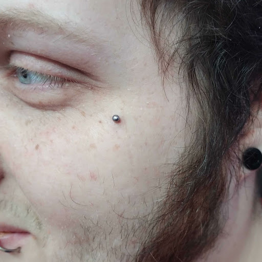 Explore tattoo ideas for men's shoulders, creative tattoo ideas in Sharon, available at Full Circle Body Art