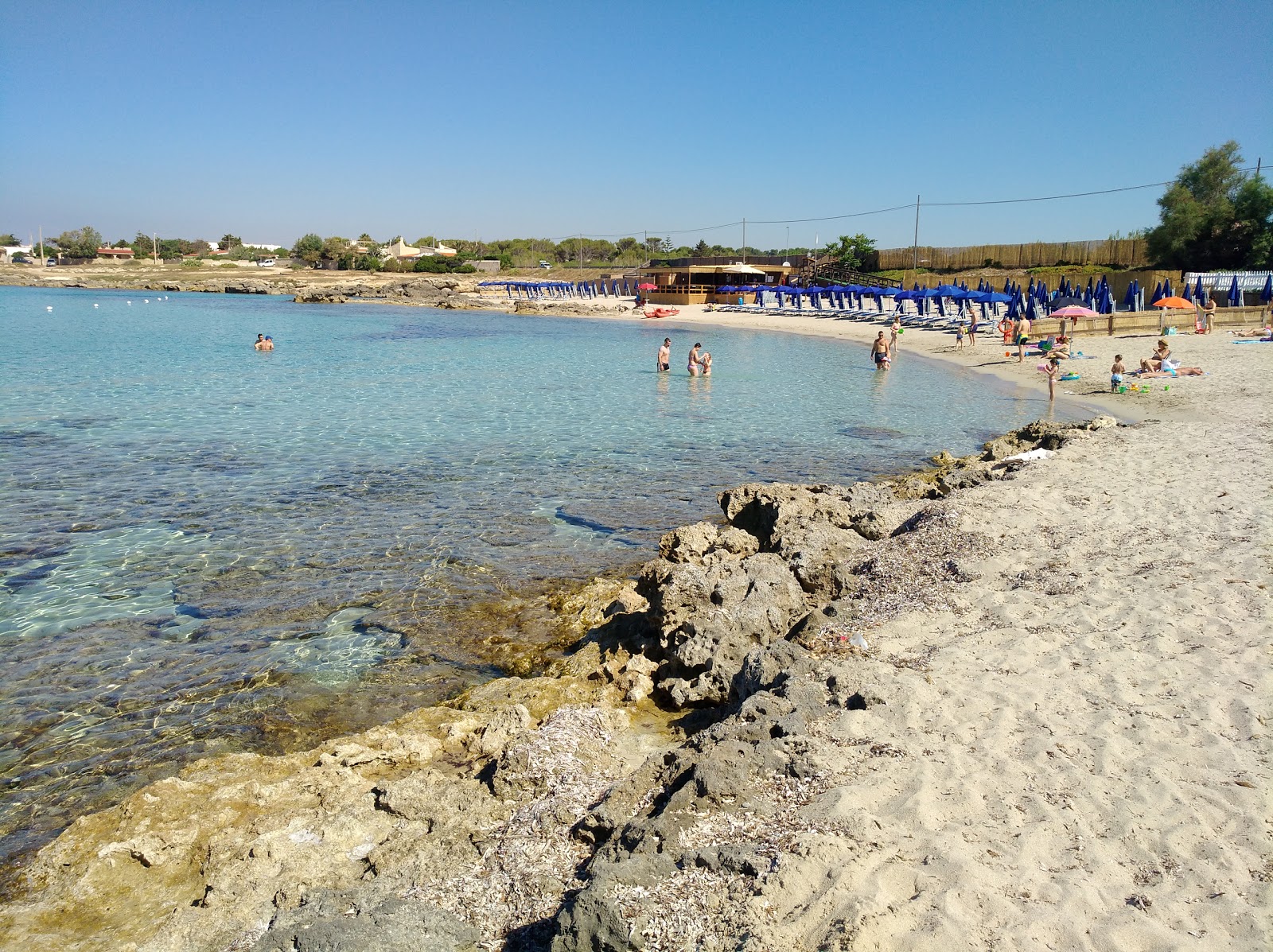 Foto av Spiaggia di Lido Checca med vit sand yta