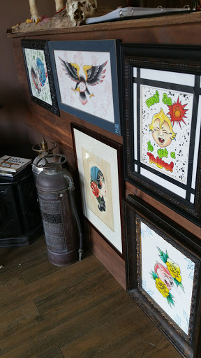 Explore postage stamp tattoo ideas, creative tattoo ideas in Kansas City, available at Steel Panther Tattoo