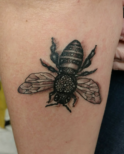 Explore arrow tattoo ideas for guys, creative tattoo ideas in Milwaukee, available at Bay Street Tattoo Co.