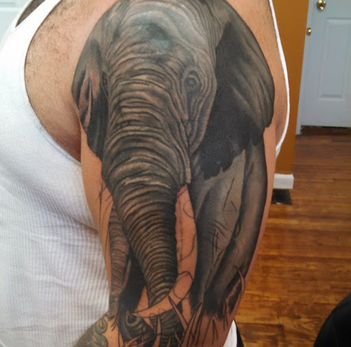 Explore cherry blossom tree tattoo ideas, creative tattoo ideas in Abington, available at Ink Boss Tattoo & Piercing Studio