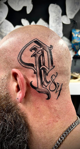 Explore skull and crossbones tattoo ideas, creative tattoo ideas in Mount Airy, available at Stainless Studios