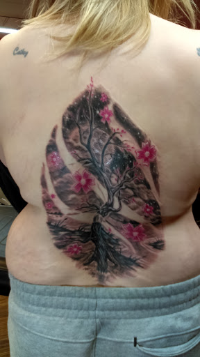 Explore cross wrist tattoo ideas, creative tattoo ideas in Warren, available at Fat Cats Tattoos