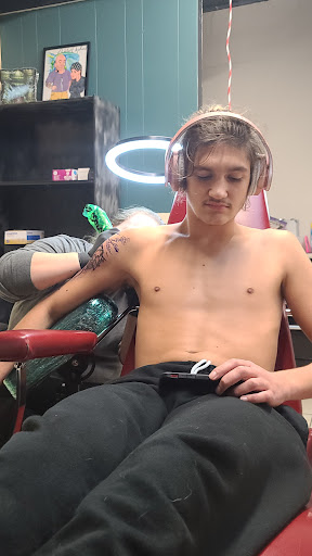 Find tattoo ideas for men music for your next unique tattoo in Cabot at Painted Elephant Studio Tattoos & Piercing Shop