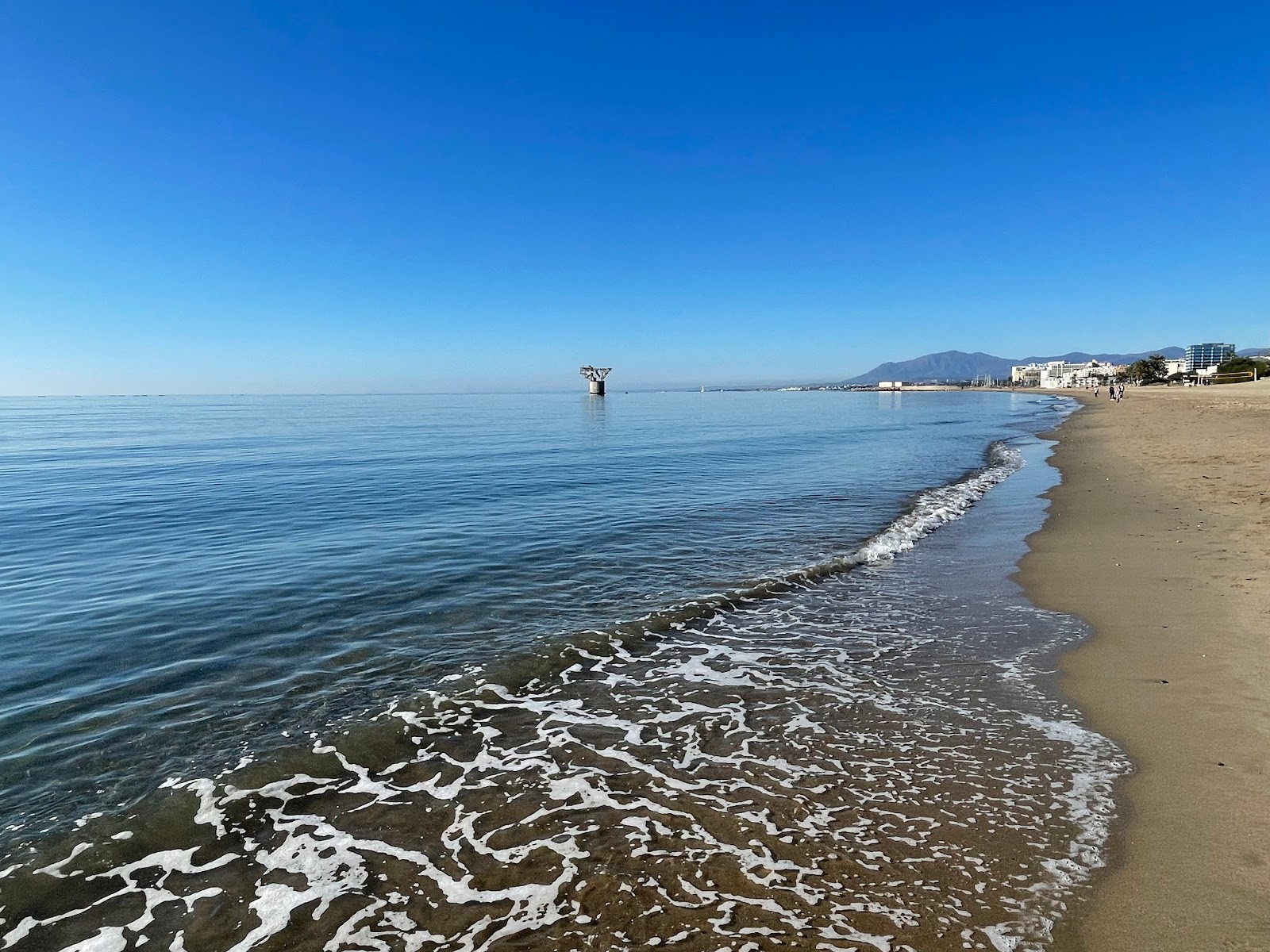 Foto von Playa del Pinillo mit beiger sand Oberfläche
