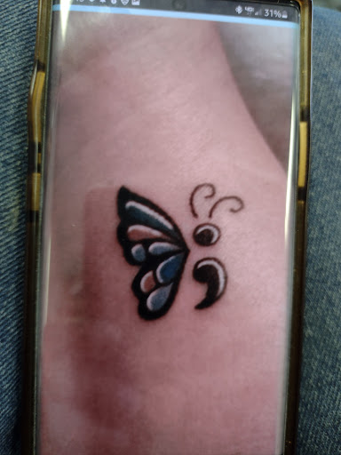 Find lesbian couple tattoos ideas for your next unique tattoo in Owosso at Twisted ink tattoo