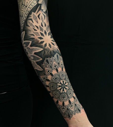 Find tattoo ideas for a mom for your next unique tattoo in Mount Clemens at Hand & Heart Tattoo